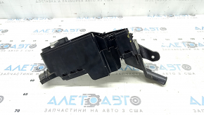 The left underhood fuse box housing for a Toyota Venza 21-24 has a broken mount.
