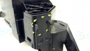 The left underhood fuse box housing for a Toyota Venza 21-24 has a broken mount.