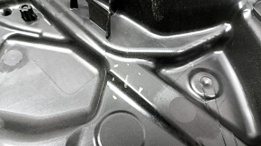 The front left window lift mechanism of a Jeep Renegade 15-23 has broken guides and broken fasteners.