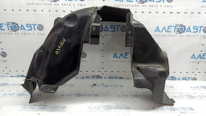 The rear right fender liner of a 19-23 Jeep Renegade is dented and the fastener is torn.