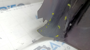 The rear right fender liner of a 19-23 Jeep Renegade is dented and the fastener is torn.