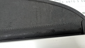 The trunk curtain of the Hyundai Tucson 22-26 is black, worn, and torn.