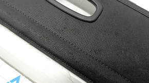 The trunk curtain of the Hyundai Tucson 22-26 is black, worn, and torn.