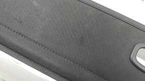 The trunk curtain of the Hyundai Tucson 22-26 is black, worn, and torn.
