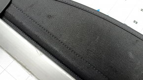 The trunk curtain of the Hyundai Tucson 22-26 is black, worn, and torn.