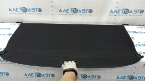 The trunk curtain of the Hyundai Tucson 22-26 is black, worn, and torn.