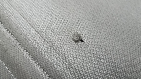 The trunk curtain of the Hyundai Tucson 22-26 is black, worn, and torn.