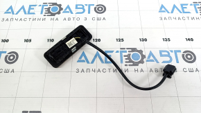 The outer trunk release button for a Hyundai Tucson 2022-2026 is cracked.