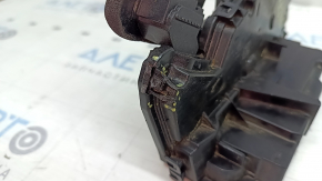 The rear right door lock on a VW Jetta 23-26 has a broken mount.