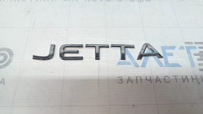 Emblem with the inscription "JETTA" on the trunk lid of the VW Jetta 22-24