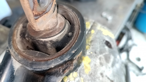 The rear right longitudinal control arm of a Lexus CT200h 11-17 has a cracked silent block.