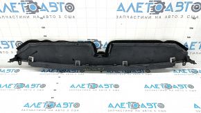 The lower radiator deflector of the Lexus CT200h 14-17 is broken and the fasteners are dented.