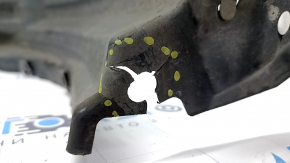The front left fender liner of a Lexus CT200h 15-17 has torn fasteners.