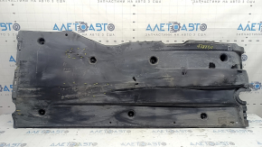 Left underbody protection for VW Jetta 19-26 is worn, dented, and the fastening is broken.