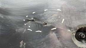 Left underbody protection for VW Jetta 19-26 is worn, dented, and the fastening is broken.
