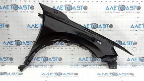 The front left fender of a Honda CRV 23-26 has a bent corner.