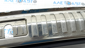 Audi Q3 83A 19-25 trunk opening trim, black with chrome, scuffs on chrome, bump