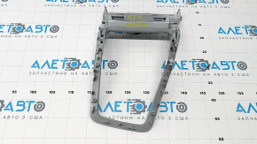The center console trim for the Audi Q3 83A 19-25 is gray and has scratches and peeling paint.