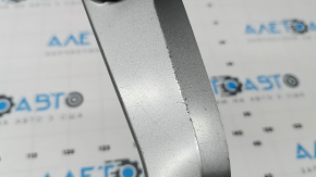 The center console trim for the Audi Q3 83A 19-25 is gray and has scratches and peeling paint.
