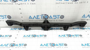 The front bumper absorber of the Audi Q3 83A 19-25 has broken fasteners and is dented.