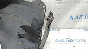 The front right fender liner of a 2021-23 Hyundai Elantra is torn, missing a fragment.