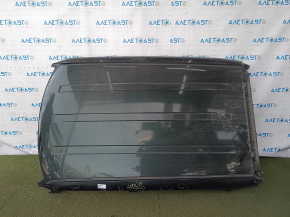 The metal roof of a Fiat 500L 14-19 is sawn off, dents, scratches