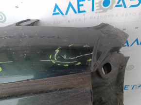The metal roof of a Fiat 500L 14-19 is sawn off, dents, scratches