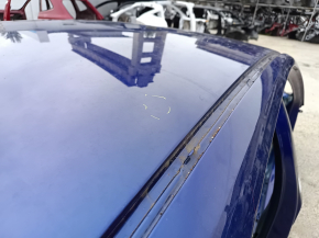 Metal roof of a 2021-26 Hyundai Elantra without a sunroof, with dents and bumps on the body.