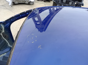 Metal roof of a 2021-26 Hyundai Elantra without a sunroof, with dents and bumps on the body.