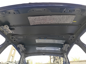 Metal roof of a 2021-26 Hyundai Elantra without a sunroof, with dents and bumps on the body.