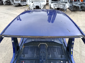 Metal roof of a 2021-26 Hyundai Elantra without a sunroof, with dents and bumps on the body.