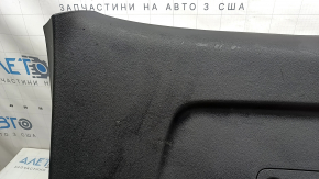 The lower trim panel of the Audi Q7 16-26 black trunk door, scratches