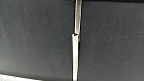 The Audi Q7 2020-2024 gray radiator grille assembly, with bracket and camera mount, is cracked and the chrome is peeling off.