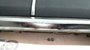 The Audi Q7 2020-2024 gray radiator grille assembly, with bracket and camera mount, is cracked and the chrome is peeling off.