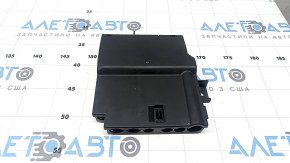 The Audi Q7 20-26 battery distribution plate in the passenger's footwell