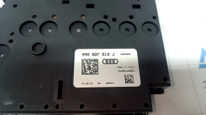 The Audi Q7 20-26 battery distribution plate in the passenger's footwell