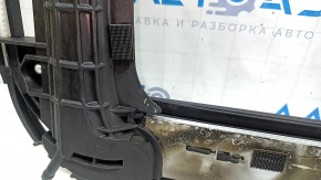 The hatch mechanism of the Toyota Highlander 14-19 frame is covered in soot, the plastic is melted.
