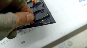 Front panel trim for the central speaker of the Toyota Sienna 21-26, black, missing fragment