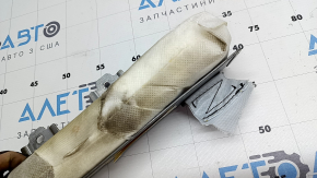 The rear right seat airbag of a Toyota Avalon 13-15 has a rusty squib and is covered in soot.