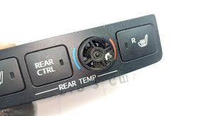 The rear seat heating control on a 13-18 Toyota Avalon is missing the chrome trim.