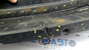 The front bumper absorber for a Toyota Avalon 2013-2014 is cracked and pinched.