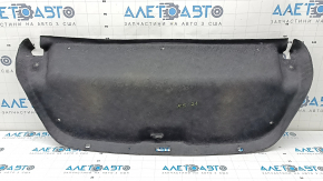 Kia K5 21-24 trunk lid trim is black and has tears.