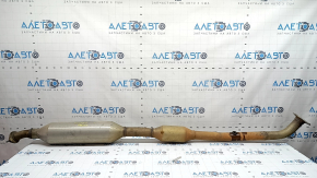 The exhaust pipe with the catalytic converter of the Toyota Avalon 13-17 2.5 hybrid is dented.