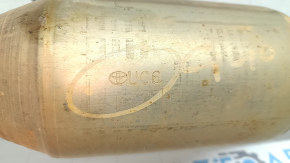 The exhaust pipe with the catalytic converter of the Toyota Avalon 13-17 2.5 hybrid is dented.