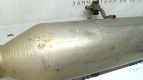 The exhaust pipe with the catalytic converter of the Toyota Avalon 13-17 2.5 hybrid is dented.