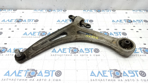 The lower front left control arm of a Kia K5 21-26 has a torn silent block.