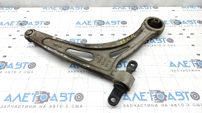 The lower front left control arm of a Kia K5 21-26 has a torn silent block.