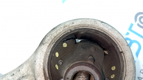The lower front left control arm of a Kia K5 21-26 has a torn silent block.