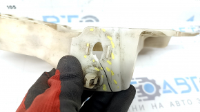 The lower right rear bumper mount for a Toyota Avalon 13-18 is broken and cracked.