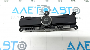 The DRIVE MODE button on the center console of the Kia K5 21-24